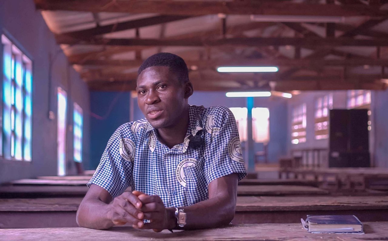 1 DANIEL SITS FOR AN INTERVIEW IN HIS SCHOOL S DINING HALL FEBRUARY 2024 1 jpg 2024 02 Ghana Daniel GSN Story child labour Approved for Full Use