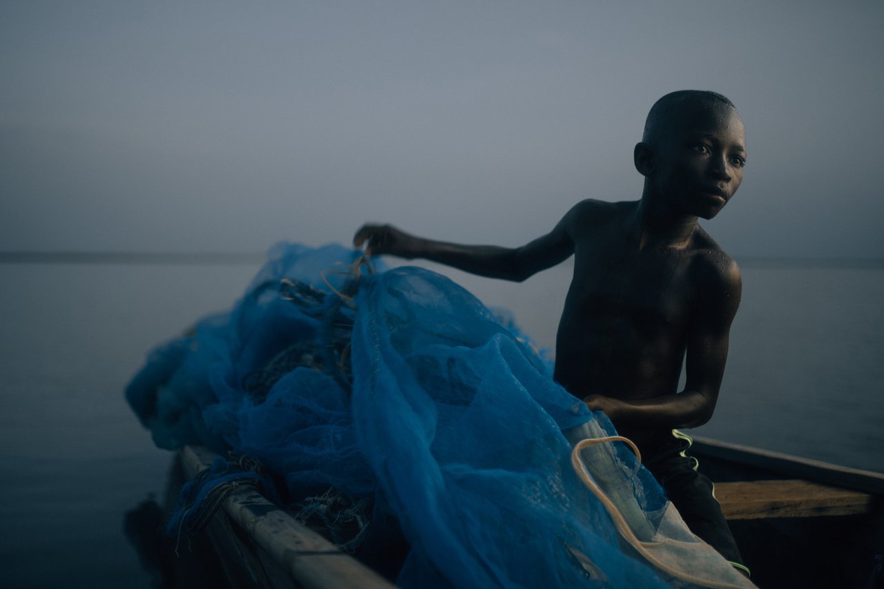 Foli Boat with Boy